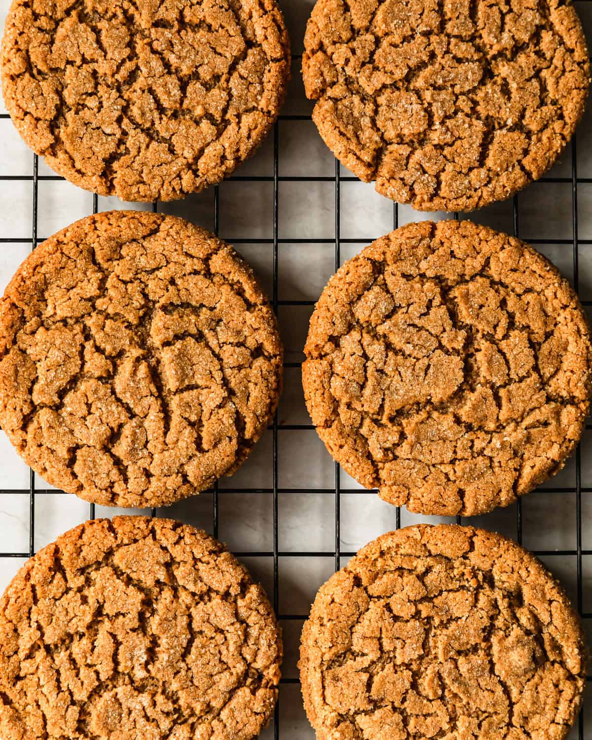 Rows of small batch peanut butter cookies on a wire rack.