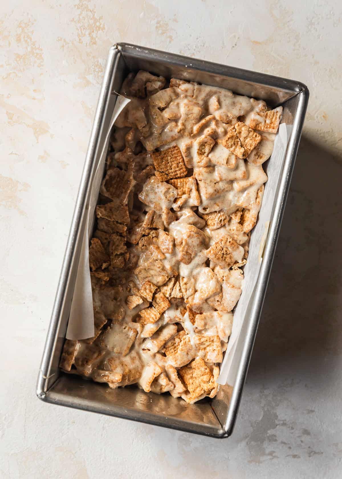 A loaf pan of small batch cinnamon toast crunch marshmallow treats.