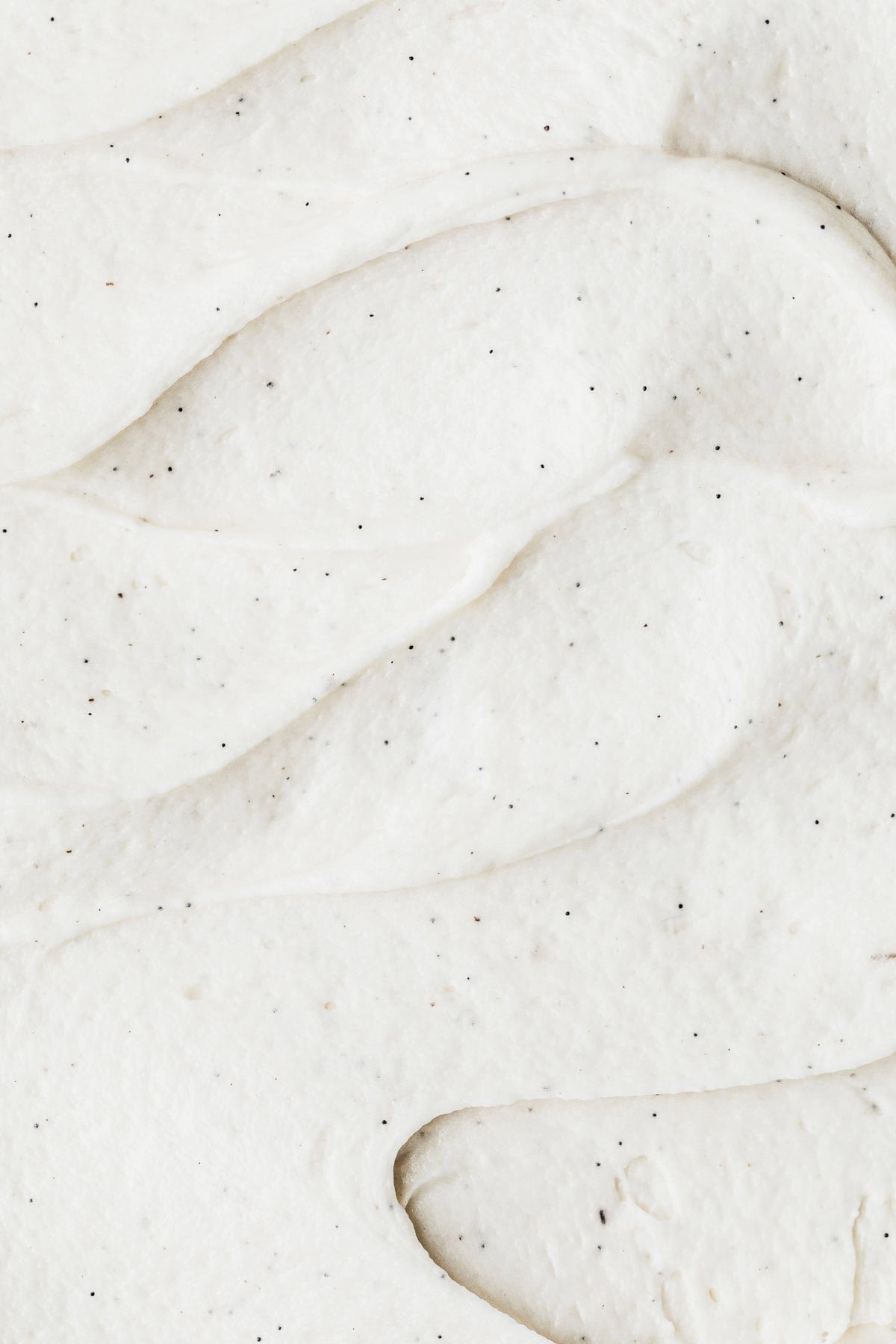 Swirls of small batch vanilla buttercream frosting.