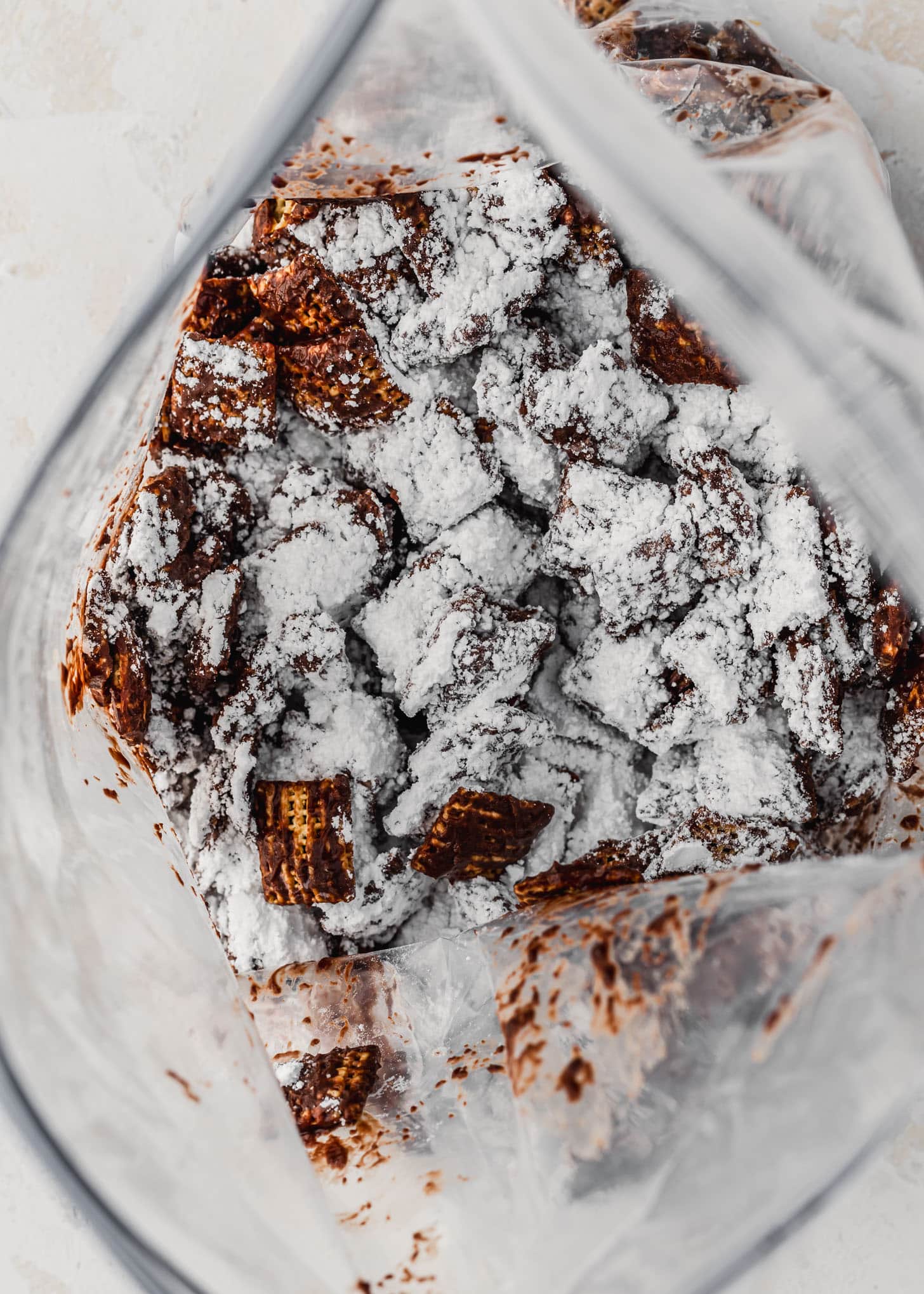A zipper bag with small batch puppy chow and powdered sugar.