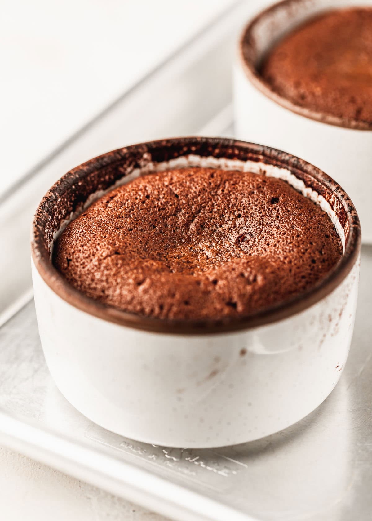 A sheet pan with lava cakes for two.