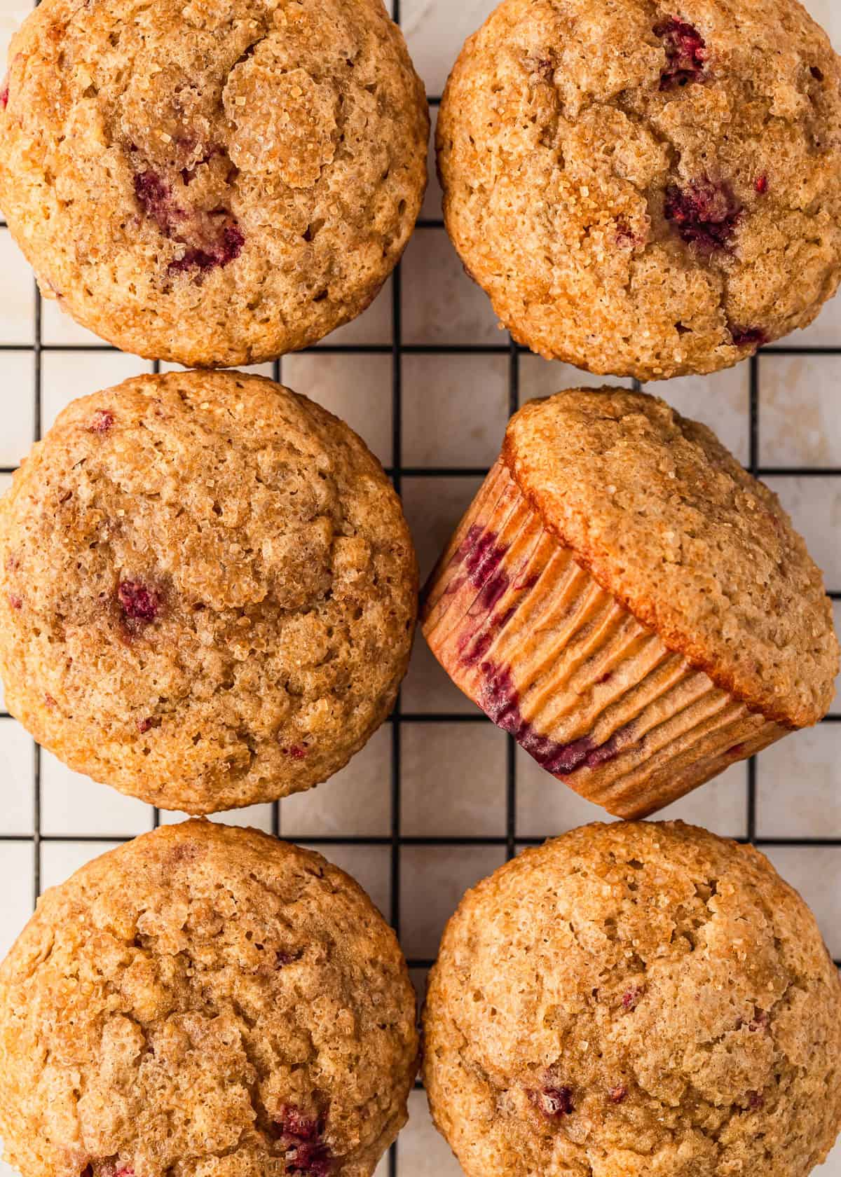 A wire rack of small batch raspberry banana muffins.