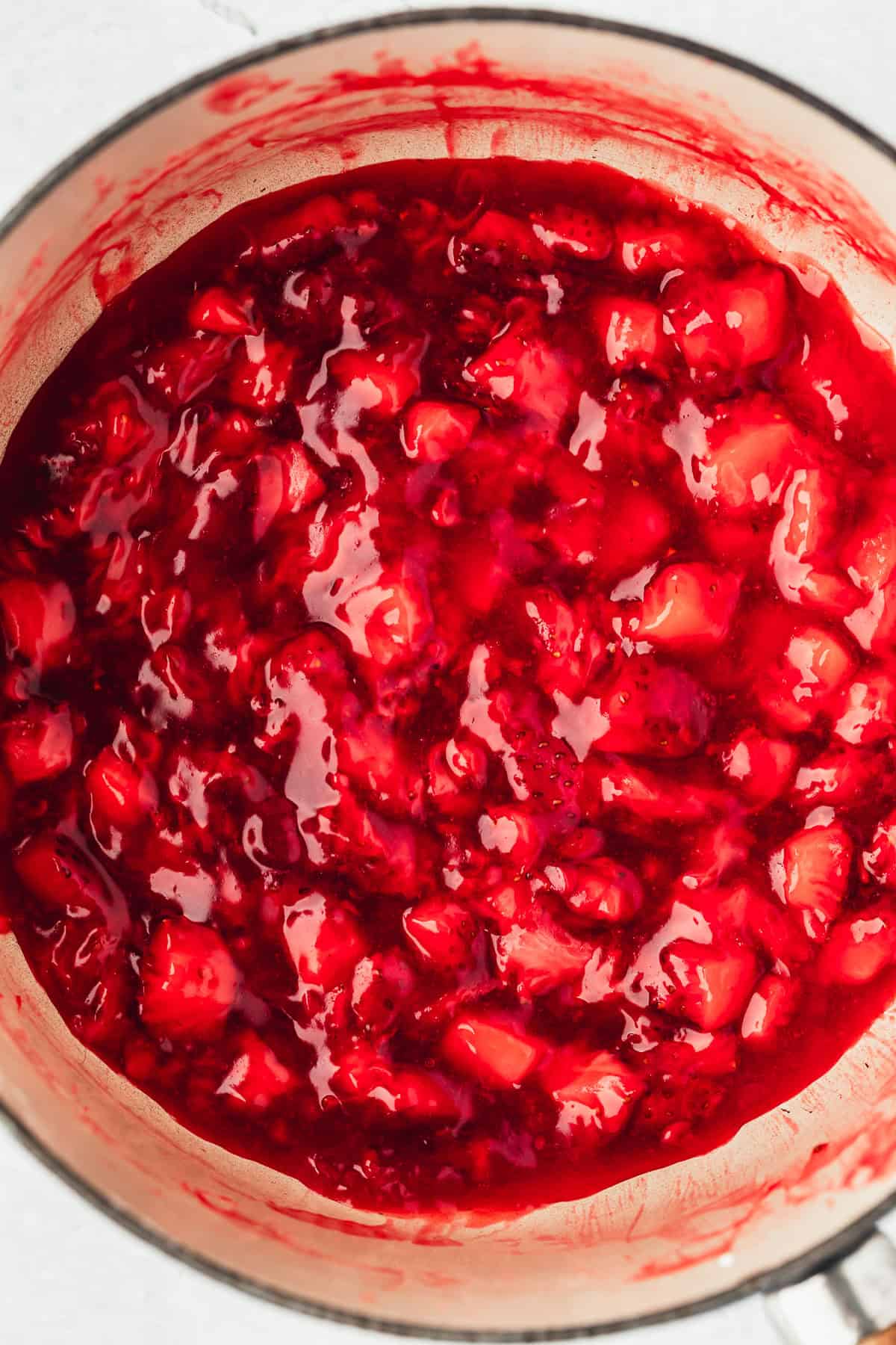 A pot of small batch strawberry filling.