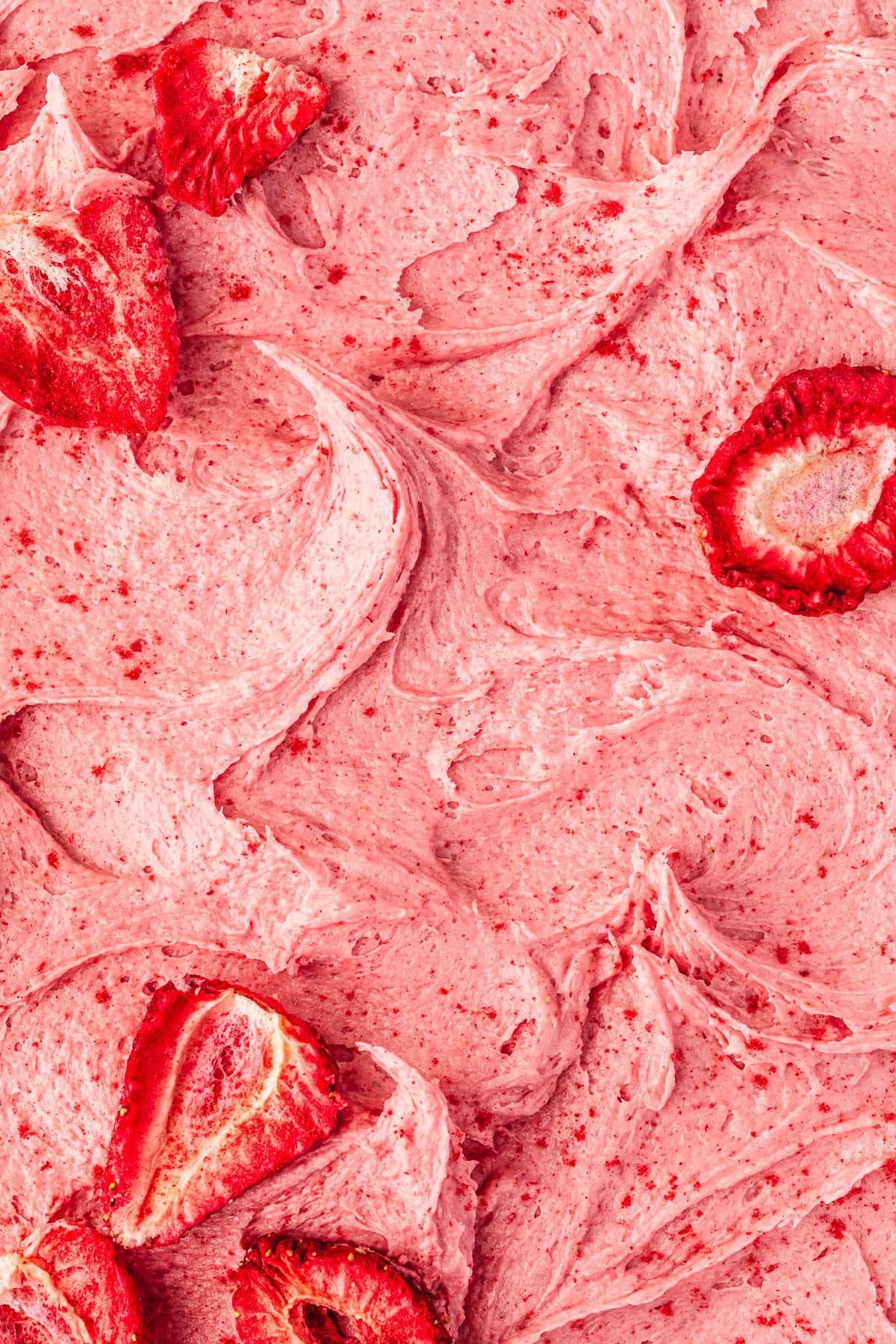 Swoops of small batch strawberry buttercream topped with a few freeze-dried strawberries.