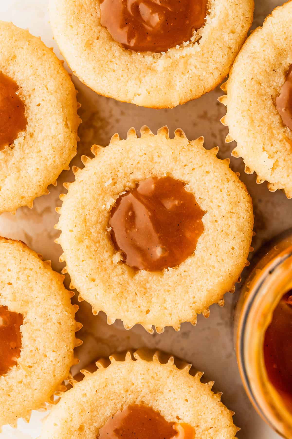 Rows of small batch caramel-filled cupcakes without frosting.